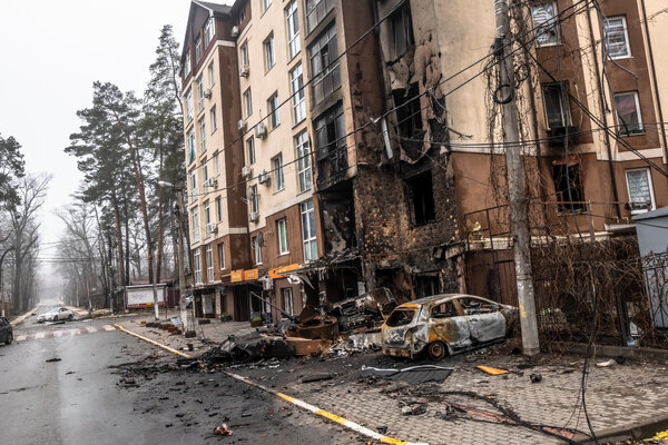 Remnants of a Russian armored personnel carrier in a residential neighborhood of Irpin, Ukraine, on Friday.