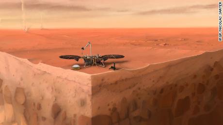 De afbeelding toont de InSight-lander van NASA die op het oppervlak van Mars zit met lagen onder het oppervlak van de planeet eronder.