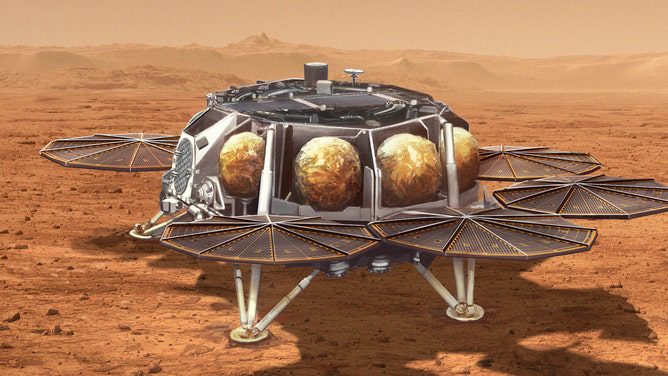 Deze illustratie toont een concept voor een voorgesteld voertuig voor het ophalen van monsters voor NASA met een kleine raket (ongeveer 10 voet of 3 meter lang), genaamd het Mars Ascent Vehicle, naar het oppervlak van Mars.  Geladen met verzegelde buizen met monsters van Mars-gesteente en grond verzameld door NASA's Perseverance-rover, zal de raket in een baan om Mars schieten.  De monsters worden vervolgens terug naar de aarde vervoerd voor gedetailleerde analyse.