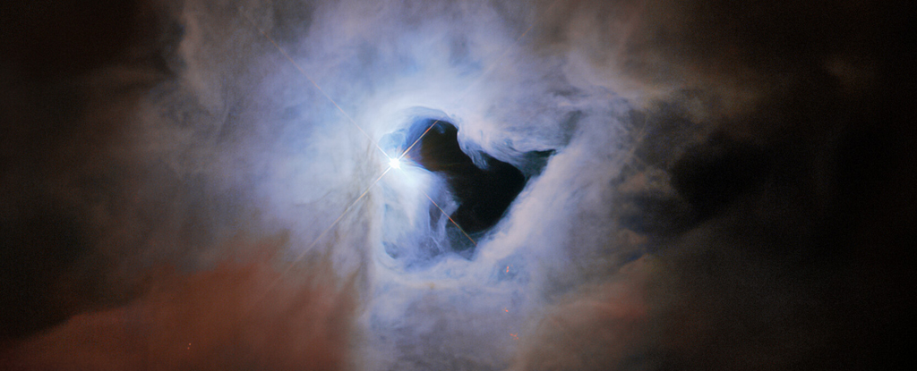 De Hubble-telescoop heeft een 'kosmisch sleutelgat' diep in de ruimte gevonden en we zijn onder de indruk: ScienceAlert